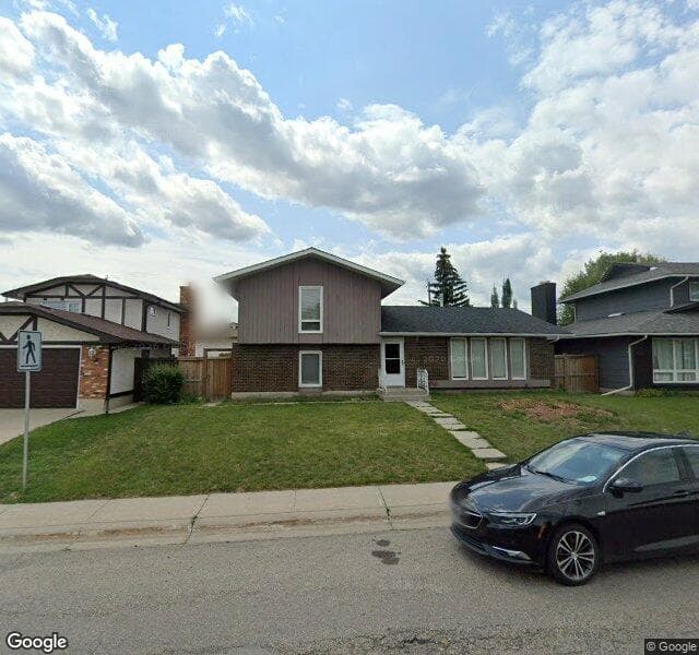 Street view of 1554 Lake Bonavista Drive SE, Calgary