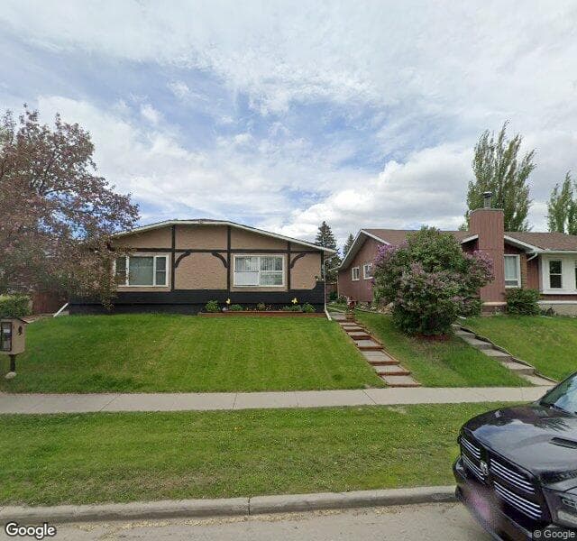 Street view of 877 Queensland Drive SE, Calgary
