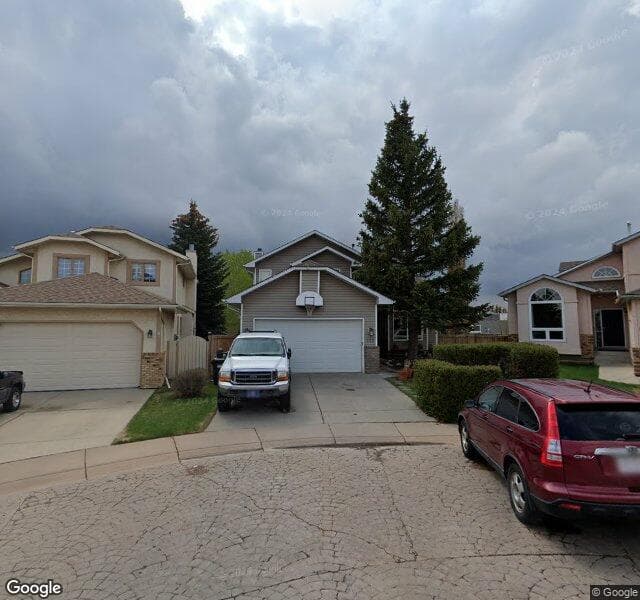 Street view of 223 Hawktree Circle NW, Calgary