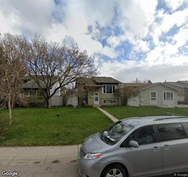 Street view of 104 Erin Grove Close SE, Calgary