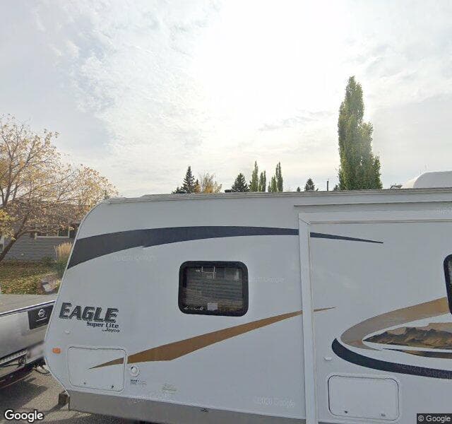 Street view of 1115 Lake Sundance Crescent SE, Calgary