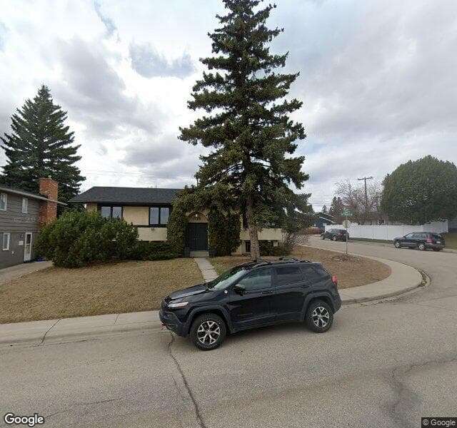 Street view of 1223 Lake Bonavista Drive SE, Calgary