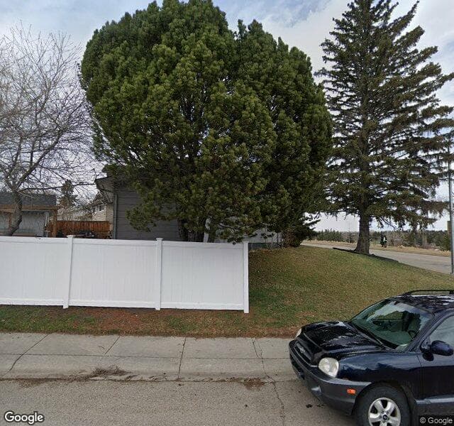Street view of 1215 Lake Bonavista Drive SE, Calgary