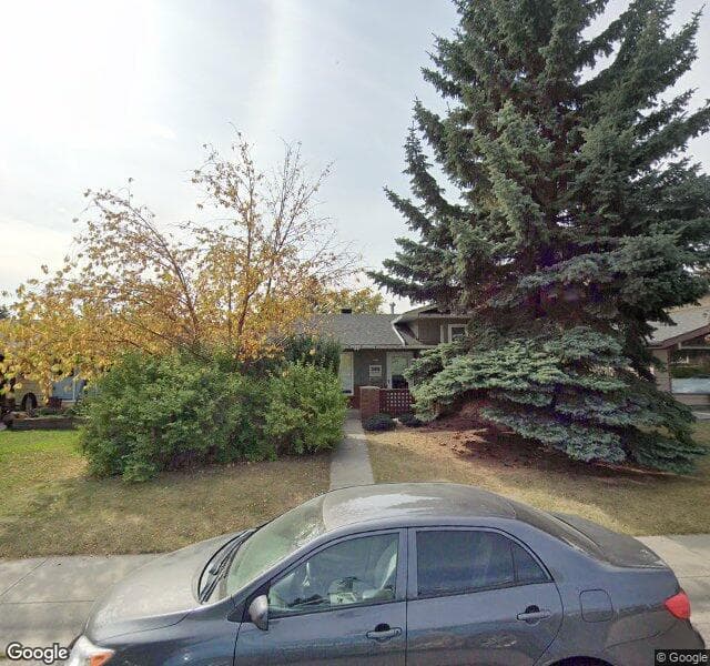 Street view of 243 Lake Lucerne Way SE, Calgary
