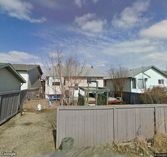 Street view of 932 Harvest Hills Drive NE, Calgary