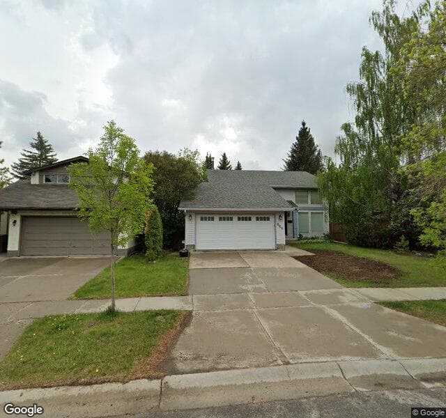 Street view of 668 Woodpark Boulevard SW, Calgary