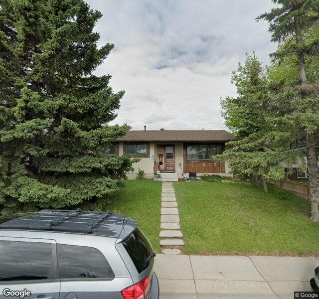Street view of 979 Pinecliff Drive NE, Calgary