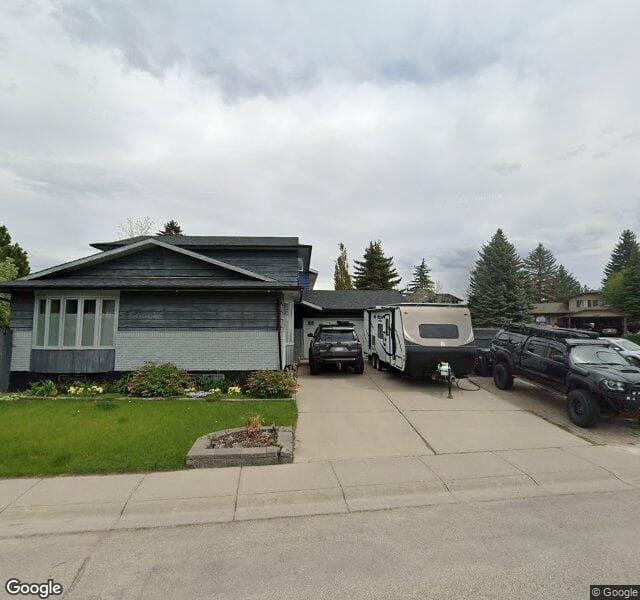Street view of 128 Deer Side Place SE, Calgary