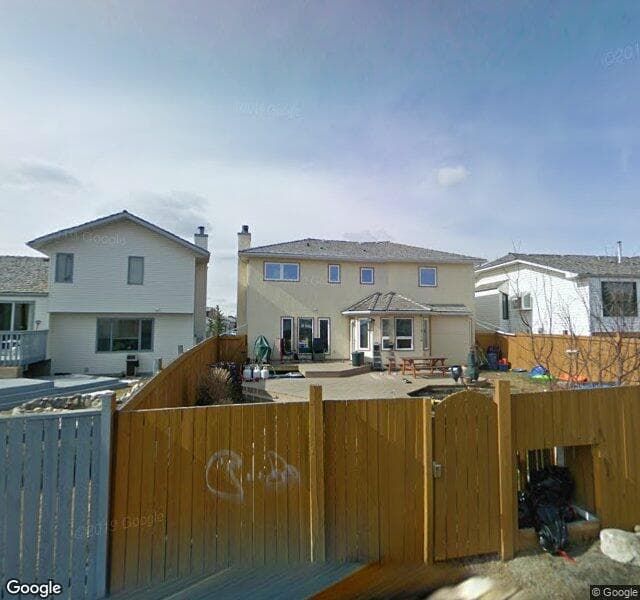Street view of 128 Harvest Hills Drive NE, Calgary