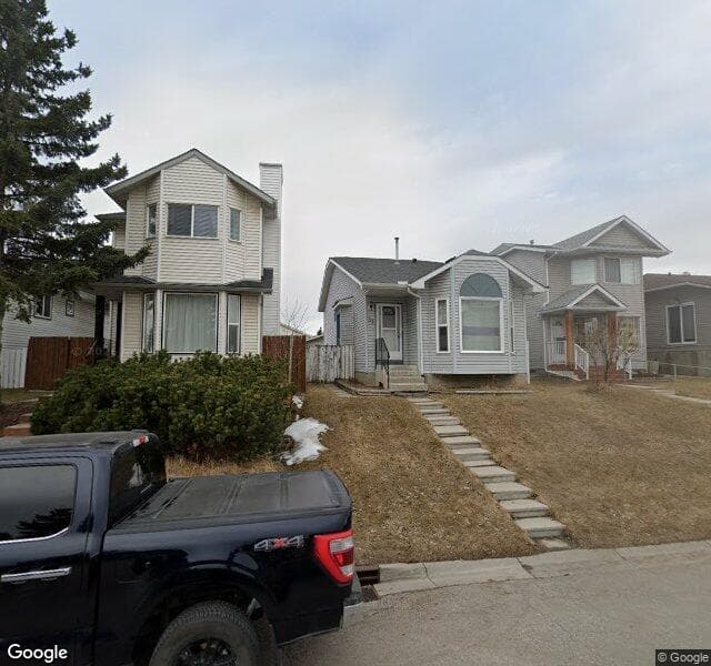 Street view of 31 Rivercrest Circle SE, Calgary