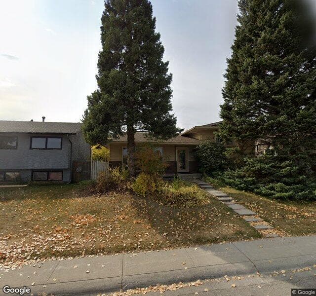 Street view of 1728 Lake Bonavista Drive SE, Calgary