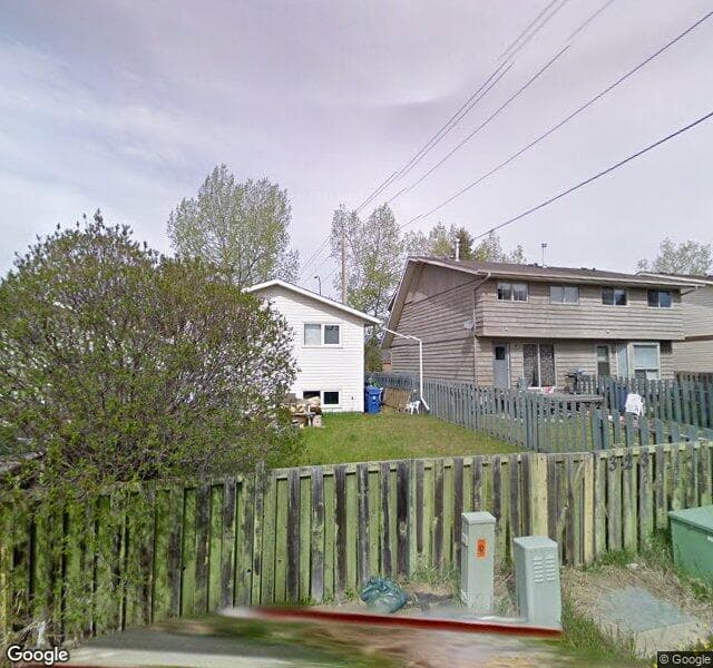 Street view of 323 Woodvale Crescent SW, Calgary