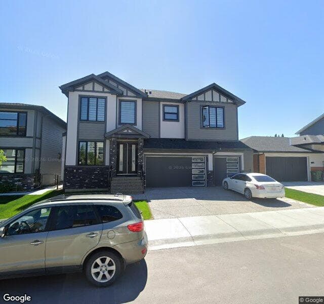 Street view of 57 Harvest Hills Manor NE, Calgary