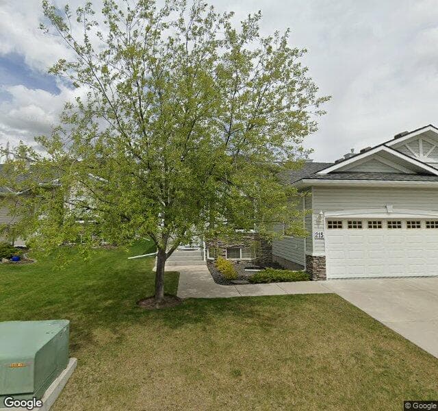 Street view of 215 Rocky Ridge Villas NW, Calgary