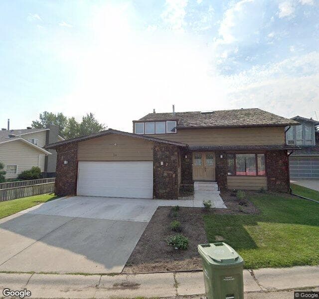 Street view of 24 Woodgrove Crescent SW, Calgary
