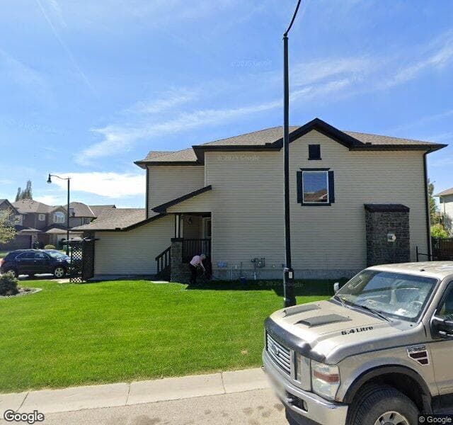 Street view of 209 Crystal Green Point, Okotoks