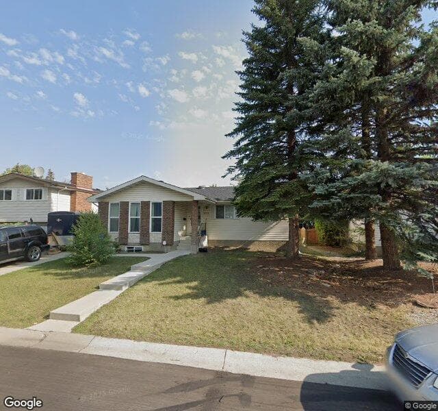 Street view of 208 Woodpark Place SW, Calgary