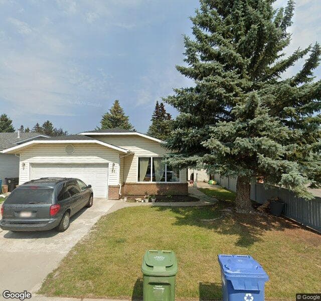 Street view of 51 Woodmont Road SW, Calgary