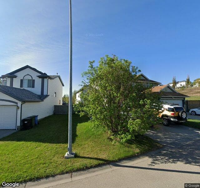 Street view of 242 Hidden Spring Mews NW, Calgary