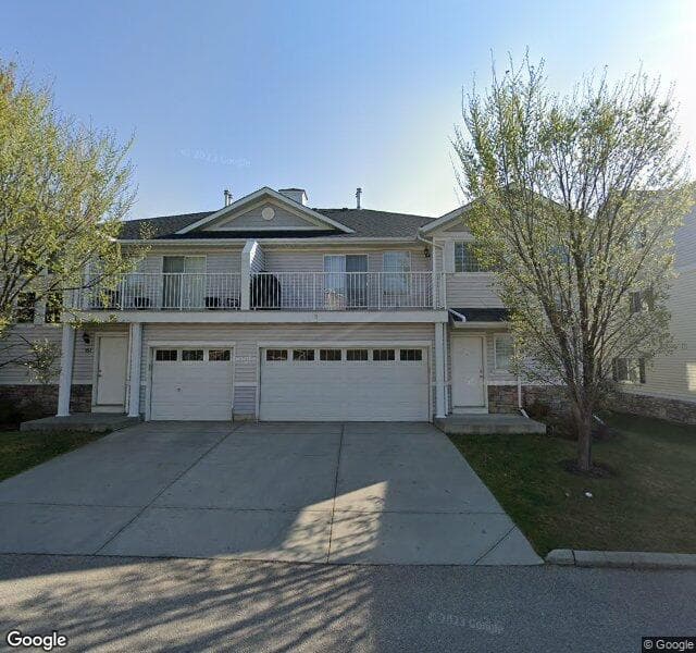 Street view of 619 Country Village Cape NE, Calgary