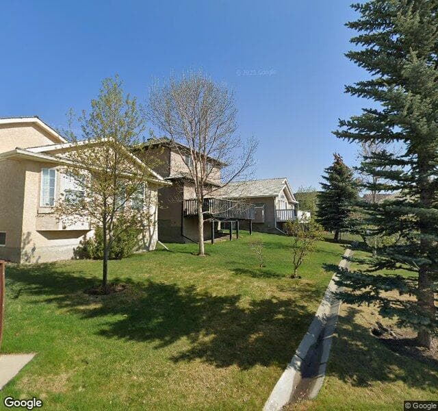 Street view of 1210 Harvest Hills Drive NE, Calgary