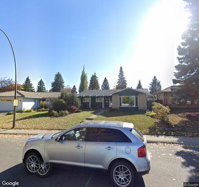 Street view of 1027 Lake Sylvan Drive SE, Calgary