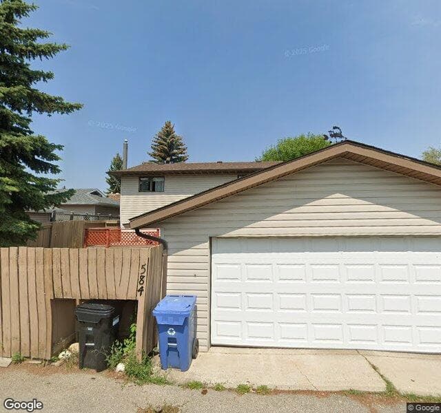 Street view of 584 Woodhill Place SW, Calgary