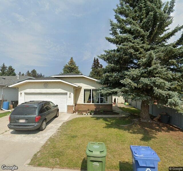 Street view of 174 Woodmont Terrace SW, Calgary