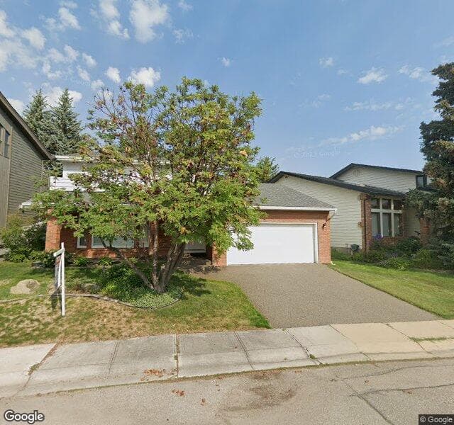Street view of 23 Woodgrove Crescent SW, Calgary