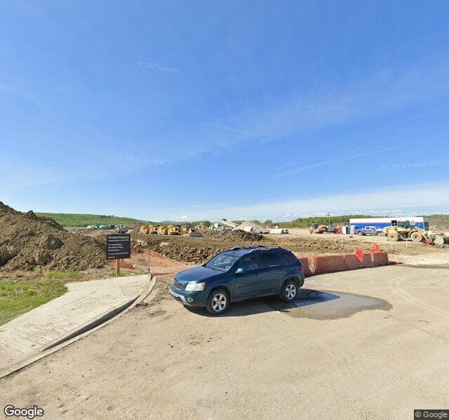 Street view of 297 Creekside Drive SW, Calgary