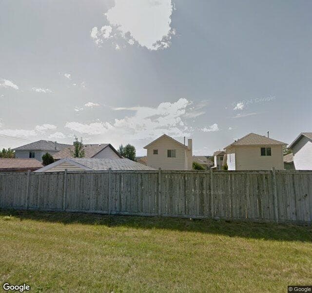 Street view of 22 Rivercrest Way SE, Calgary