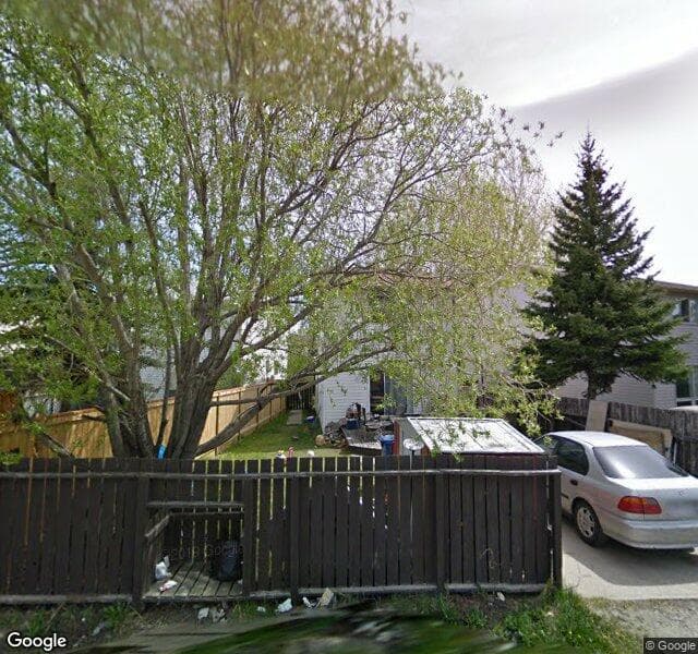 Street view of 210 Woodmont Court SW, Calgary
