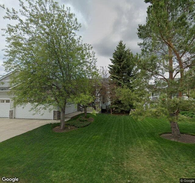 Street view of 19 Rocky Ridge Villas NW, Calgary