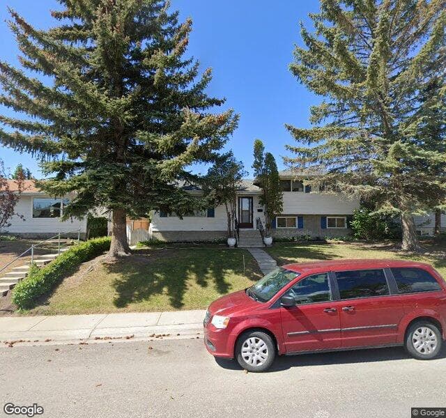 Street view of 6839 Huntridge Hill NE, Calgary