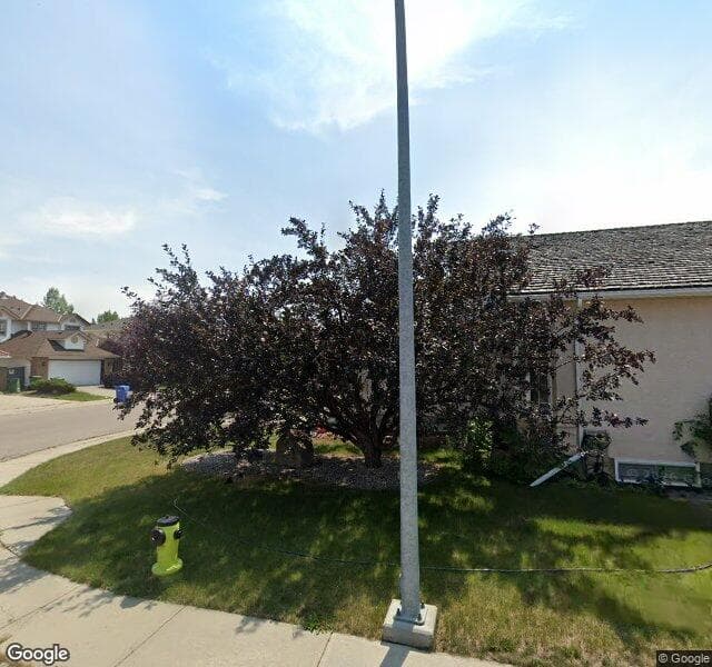 Street view of 71 Woodpark Close SW, Calgary