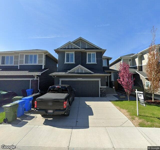 Street view of 49 Creekside Avenue SW, Calgary