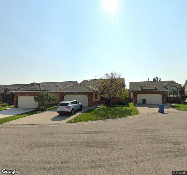 Street view of 58 Evergreen Bay SW, Calgary