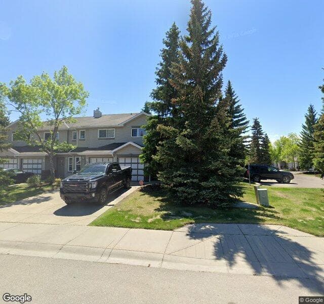 Street view of 902 Harvest Hills Drive NE, Calgary