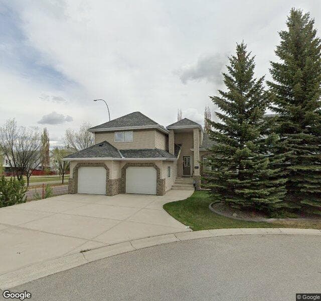 Street view of 545 Rocky Ridge Bay NW, Calgary